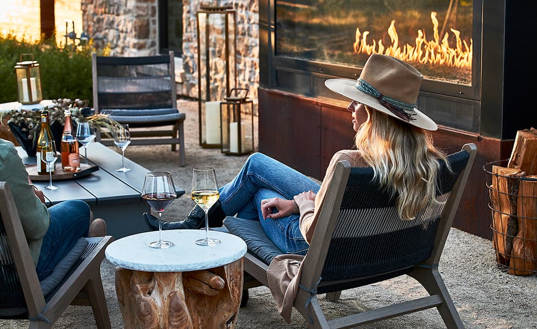 A Couple relaxing in front of a fire at the Stockman